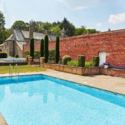 A luxurious outdoor swimming pool at Kington Lodge
